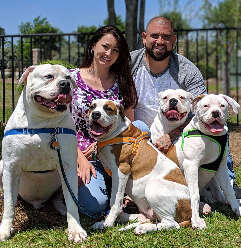 Dr. Seale, her husband, and their four dogs