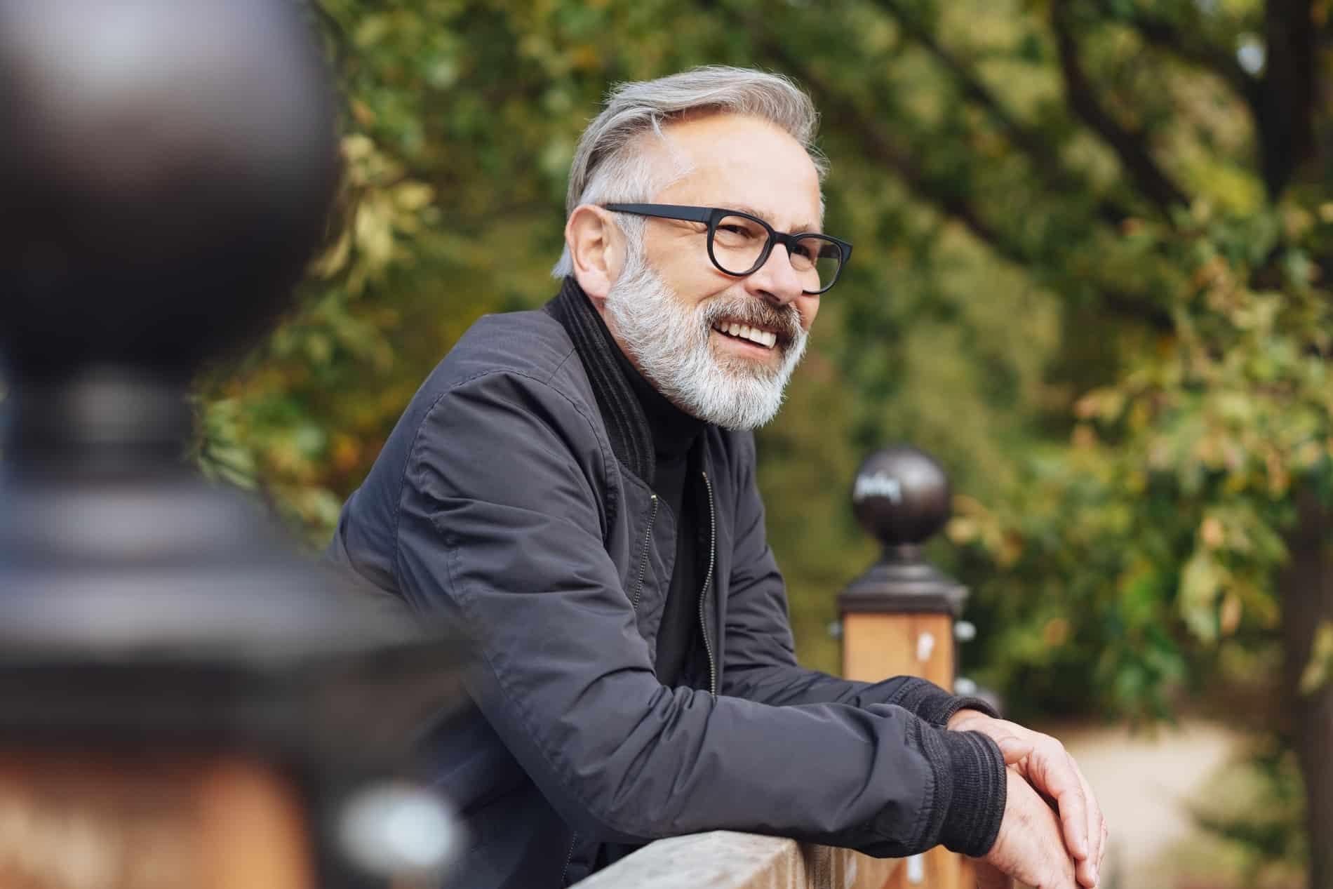 Man with a fully renewed smile after dental reconstruction at iHeart Dental in Rincon GA